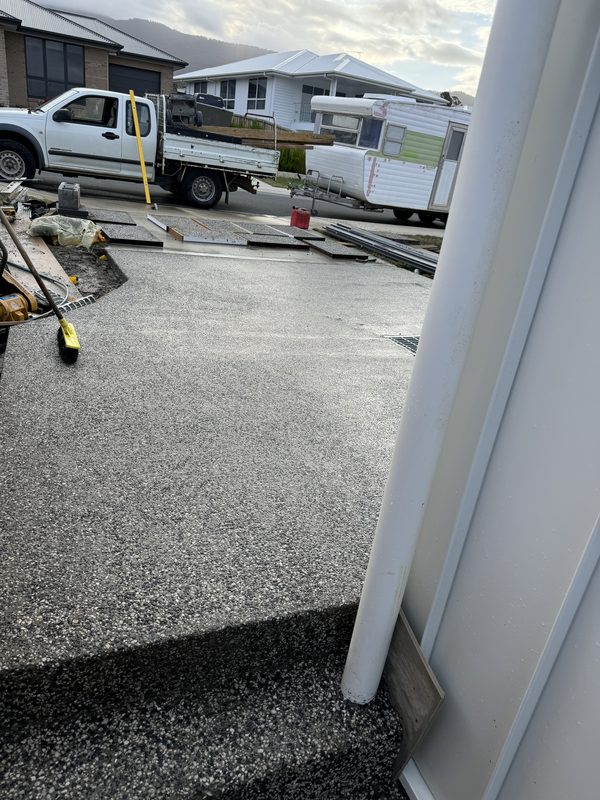 Freshly washed exposed aggregate driveway.