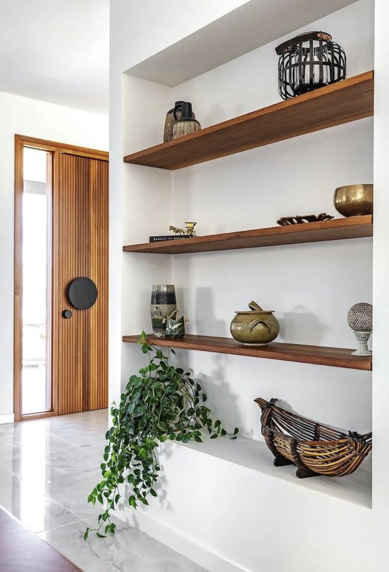 Hallway niche with floating timber shelves