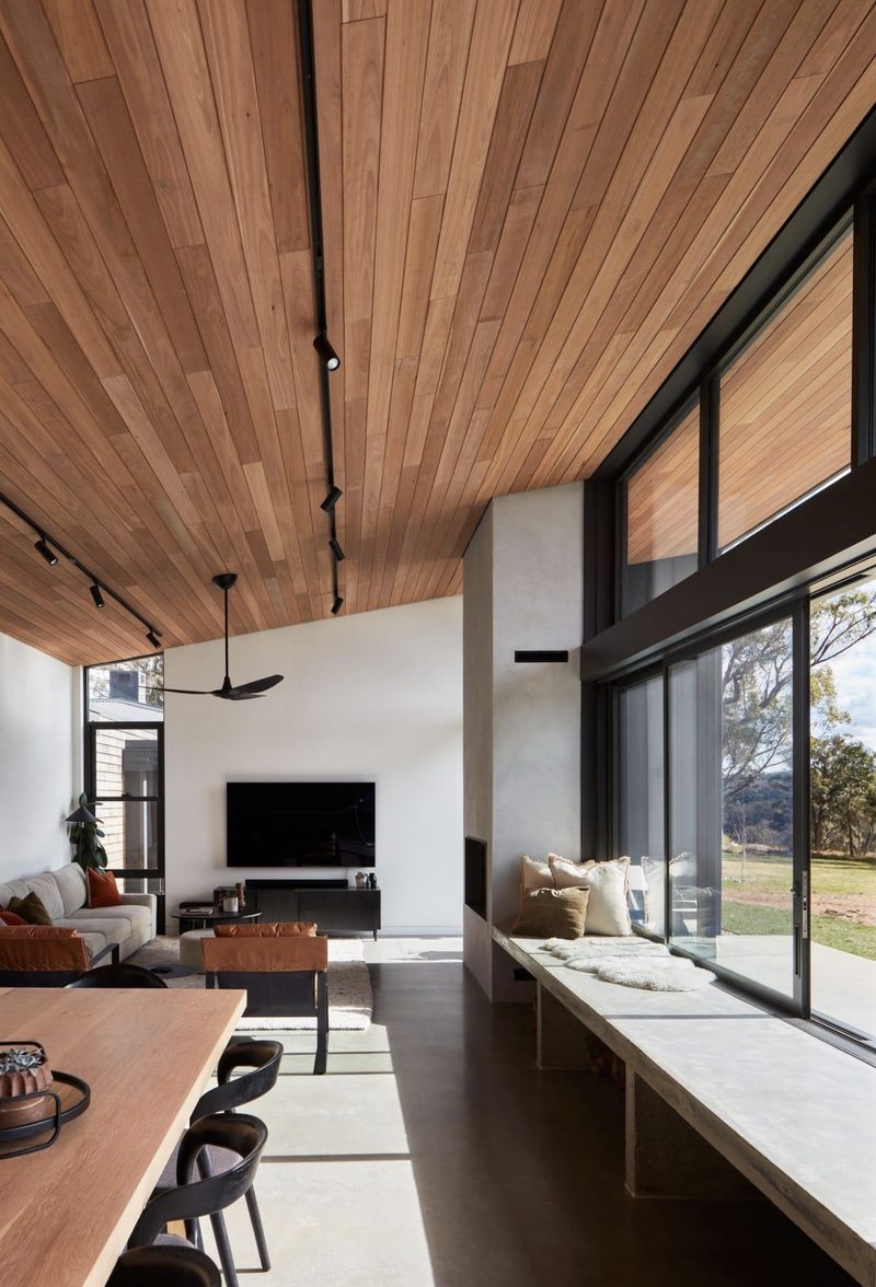 Open living-dining under a timber ceiling